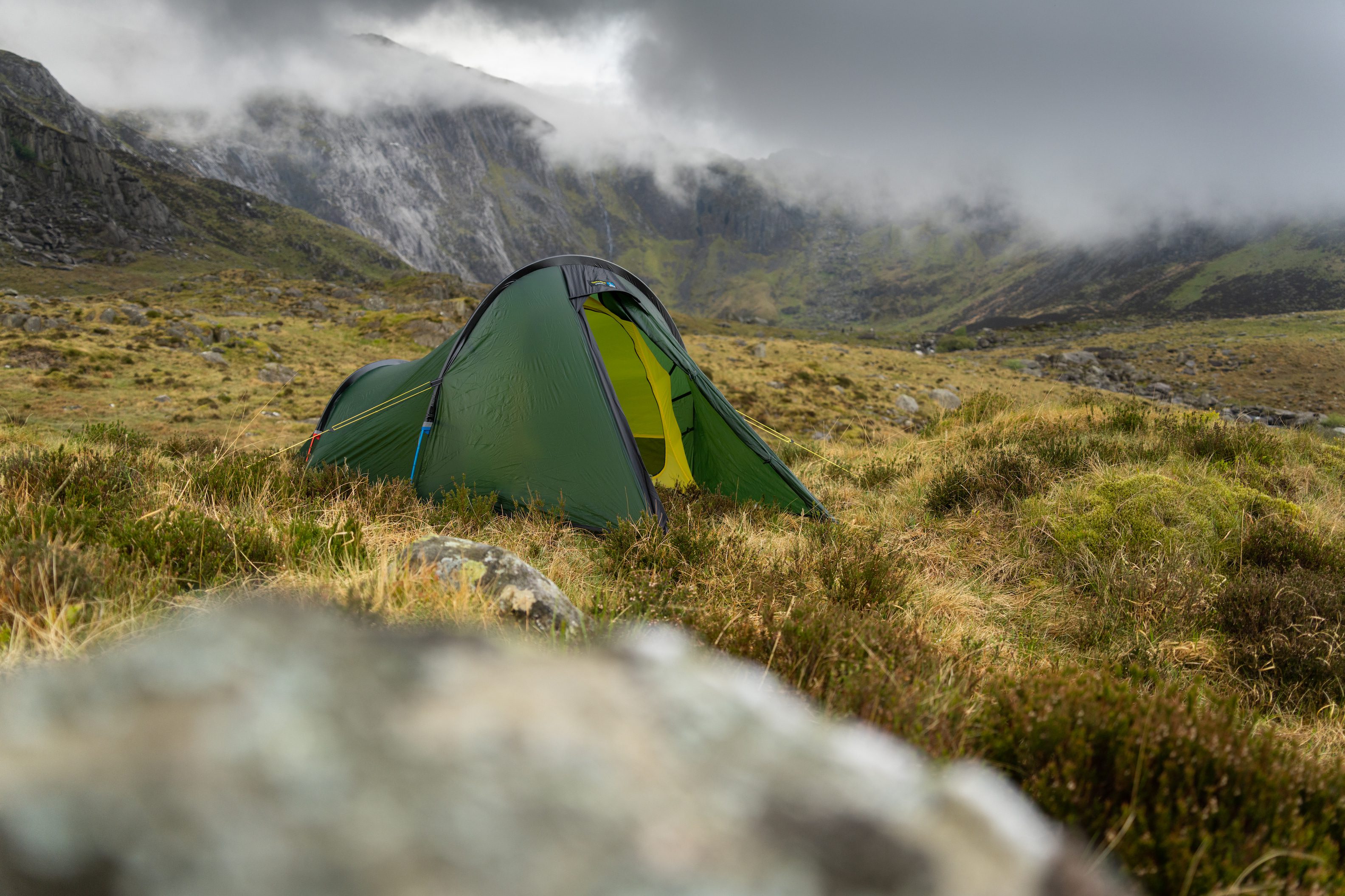 A tent pitched in fair weather in Snowdonia overlooking Devils Kitchen 