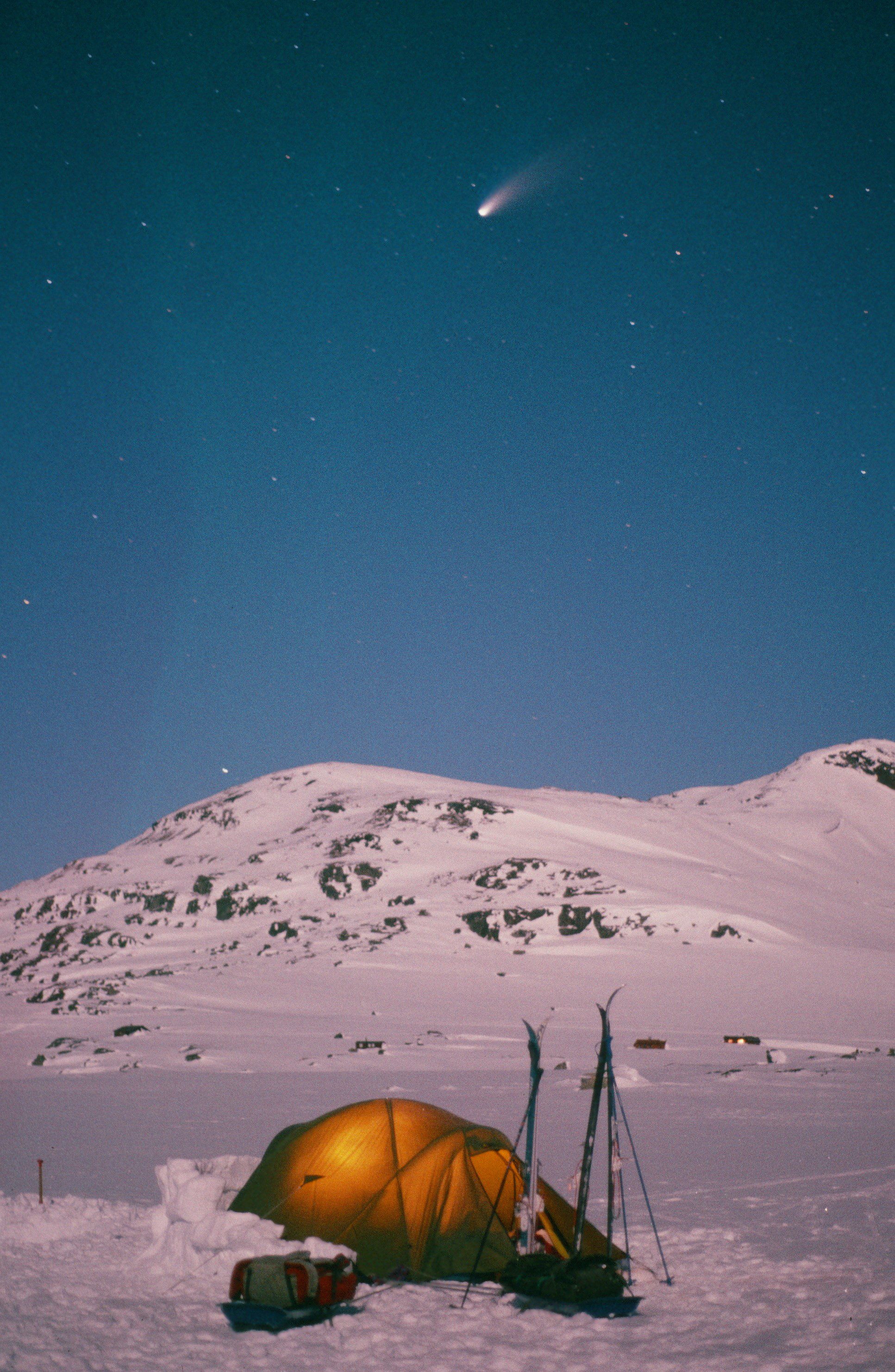 A Quasar tent pitched in the remote region of Hardangervidda in Norway with the Hale Bopp Coment lighting up the skies