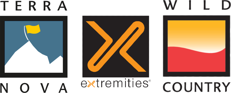 Three outdoor brand logos side by side: left, the Terra Nova logo showing a stylised white mountain on a blue square topped by a small yellow flag with TERRA NOVA text; centre, the Extremities logo with an orange stylised 'X' on a black square and 'extremities' text beneath; right, the Wild Country by Terra Nova logo showing a square with a yellow-to-red gradient wave and 'WILD COUNTRY' with 'by Terra Nova' text.