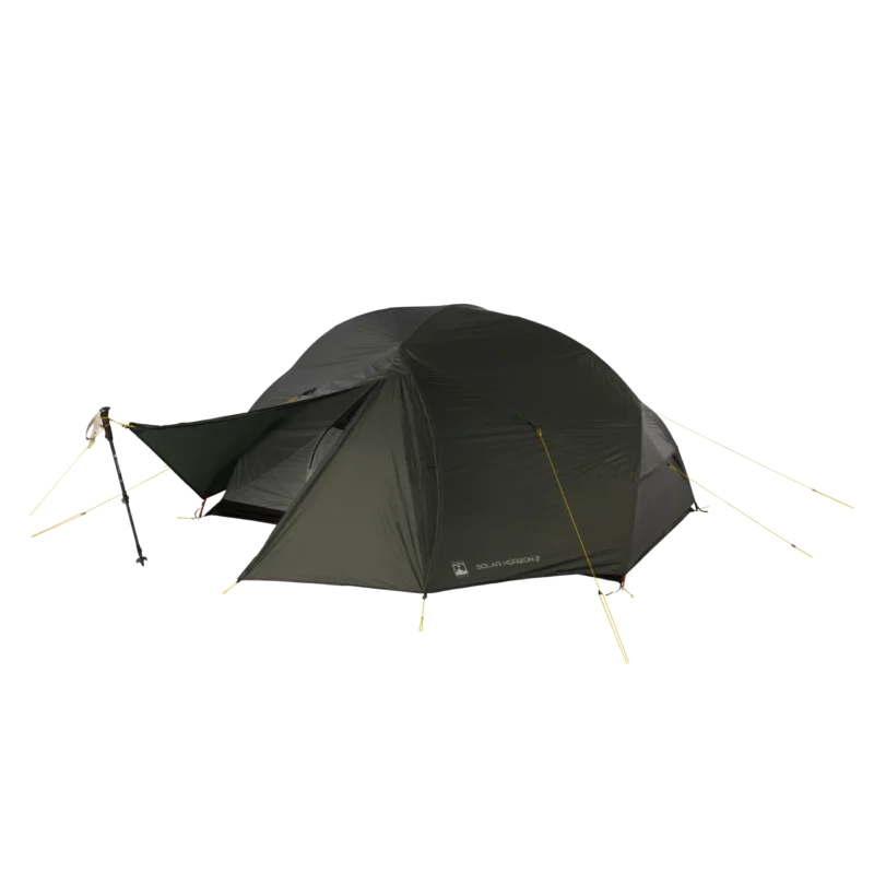 Olive-green two-person dome tent with a small front vestibule propped by a trekking pole, taut yellow guylines and stakes securing the rainfly.
