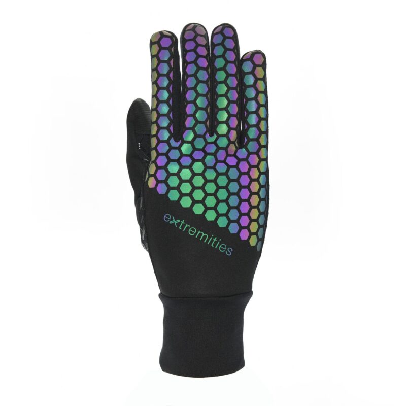 Black glove shown flat on a white background with a fitted wrist cuff, decorated on the back of the hand and fingers by an iridescent green‑blue‑purple hexagonal honeycomb pattern and a small "extremities" logo above the wrist.