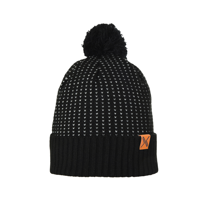 Black knit beanie with a pom-pom, small white dotted vertical pattern, ribbed folded cuff and a small orange logo patch on the side