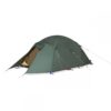41EQU-Expedition-Quasar-2500x2500-1-e1636639940945-3.jpg Green dome-style camping tent with a partially open vestibule revealing a yellow inner tent, secured with guy lines and stakes against a white background.