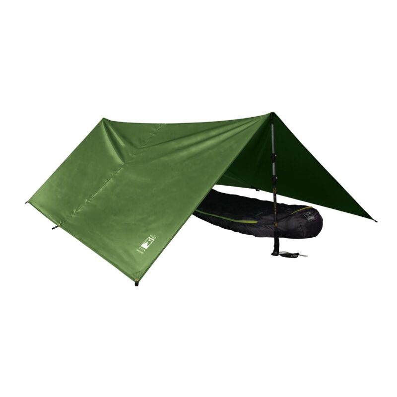 Green A-frame tarp shelter pitched over a black mummy sleeping bag, corner grommets and guy points visible and one end supported by an adjustable trekking pole