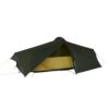 43LCPT2-Laser-Compact-2-3000x3000px-300dpi-scaled-e1636632903219-3.jpg Low-profile dark green tunnel backpacking tent with a partially opened fly revealing a yellow inner sleeping compartment, arched single pole and tensioned guy lines visible against a white background