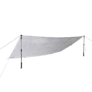 Light grey rectangular camping tarp stretched into a low angled shelter, tensioned by two adjustable trekking poles with guy lines and stake points against a white background.