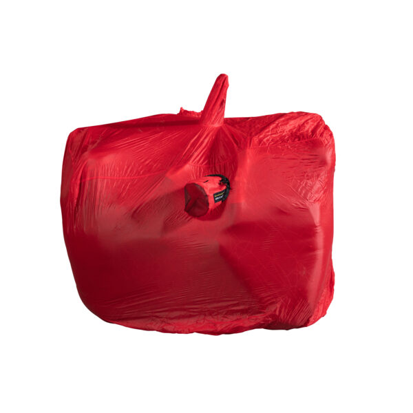 Bright red protective travel cover stretched over a bicycle, showing the handlebars and saddle outline and a small round zippered mesh pocket on the side.