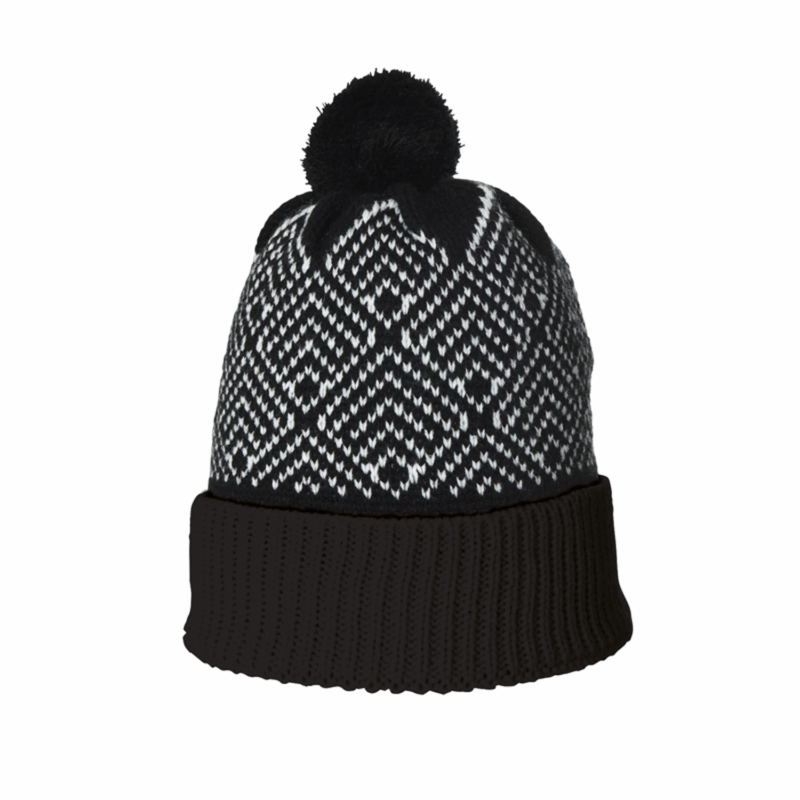 Antares-Beanie-1500x1500-1-1.png Black and white knitted beanie with a folded ribbed cuff, repeating geometric Fair Isle–style pattern and a black pom‑pom on top