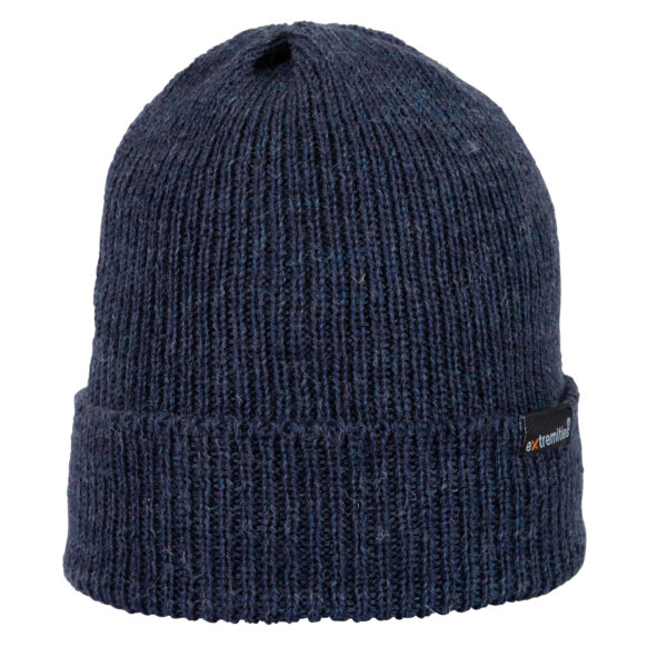 Bakewell-Beanie-Denim-Cut-Out-300dpi-1.jpg Navy ribbed knit beanie with a folded cuff and visible woolly texture, featuring a small black rectangular brand tag on the side.