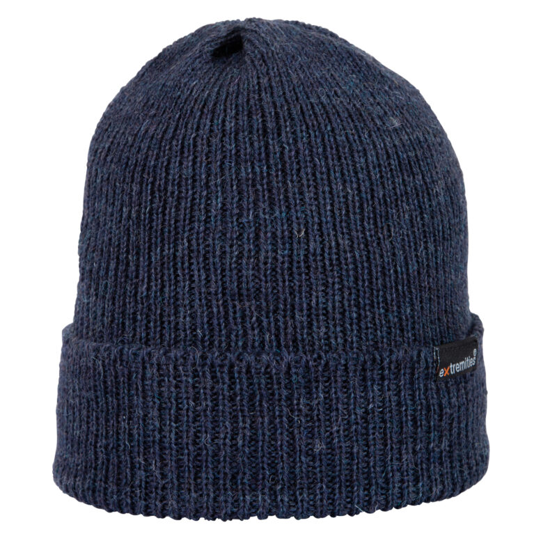 Navy ribbed knit beanie with a folded cuff and visible woolly texture, featuring a small black rectangular brand tag on the side.