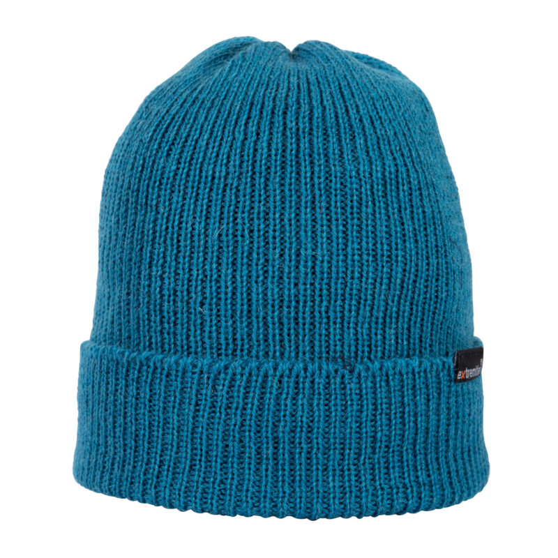 Teal ribbed knit beanie with a folded cuff and a small black brand tag on the side, photographed against a plain white background.