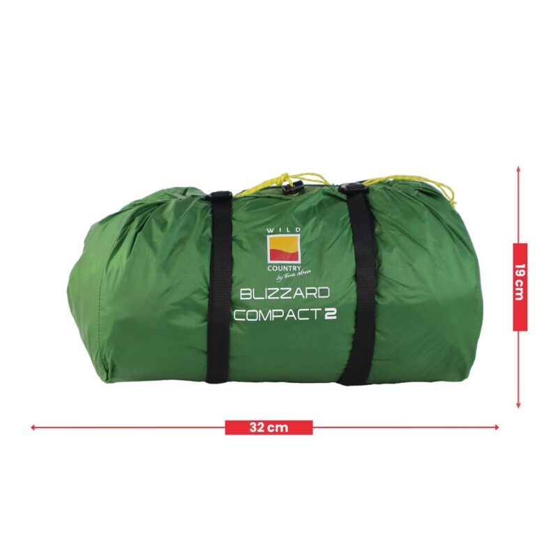 Green rolled sleeping bag in a compression sack with two black straps and yellow drawcords, labelled "Blizzard Compact 2", shown against a white background with red arrows indicating 32 cm length and 19 cm height.