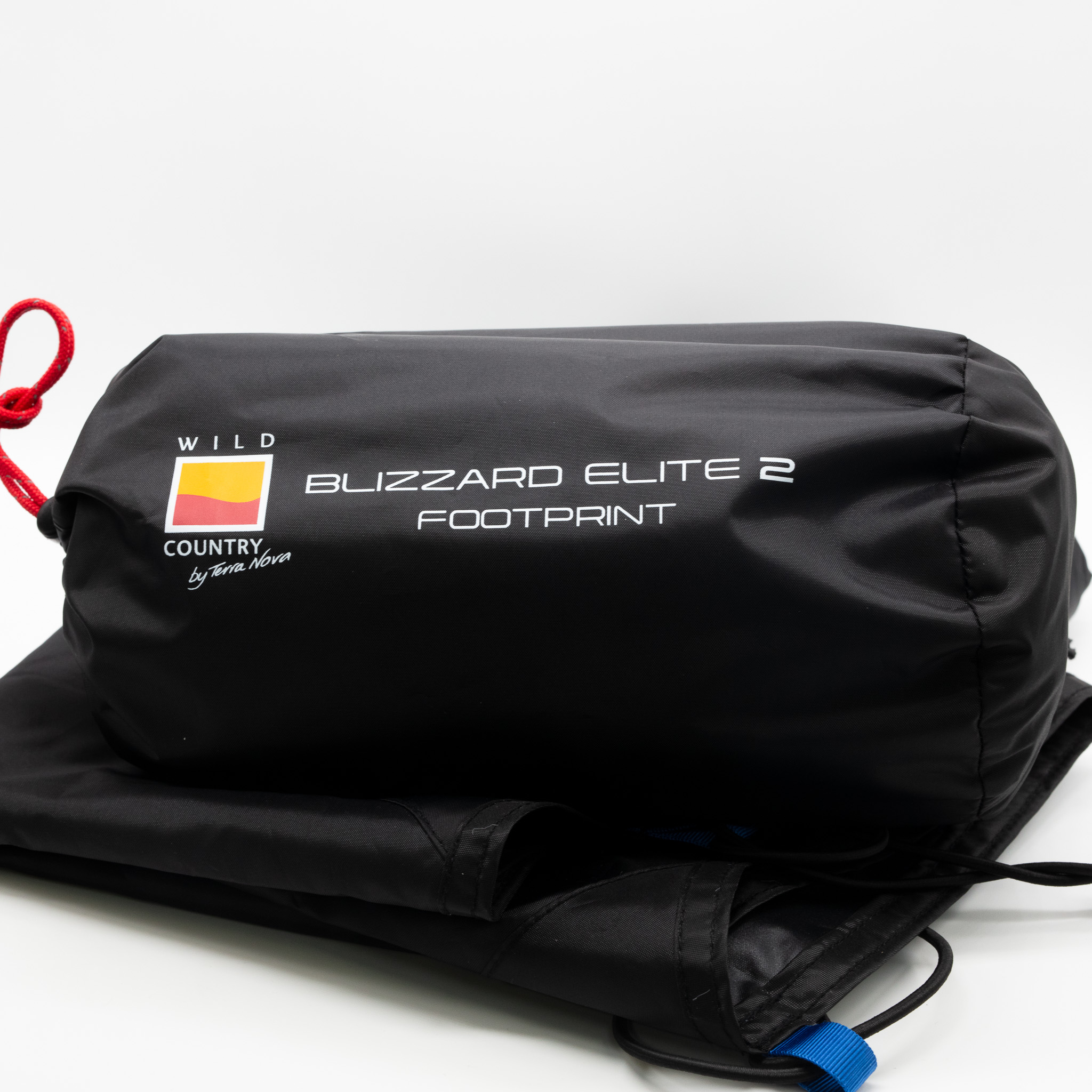 Blizzard-Elite-2-2-3.jpg Black roll-style storage bag labelled Blizzard Elite 2 Footprint with a yellow-and-red Wild Country logo, red drawcord and folded black footprint fabric on a plain white background