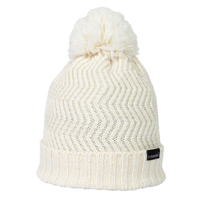 Castleton-Beanie-Arran-Cut-Out-300dpi-1.jpg Cream knitted beanie with a fluffy pom‑pom, chevron zigzag stitch pattern and folded ribbed cuff with a small black brand tag
