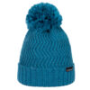 Teal knitted beanie with a ribbed turned-up cuff, chevron knit pattern and a large fluffy pom‑pom on top, plus a small black brand tag on the cuff.
