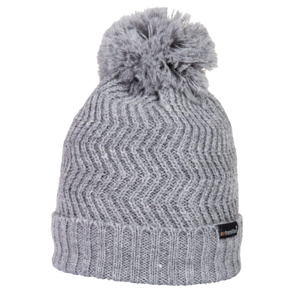 Grey knitted beanie with a folded ribbed cuff, zigzag chevron stitch pattern and a fluffy pom-pom on top against a plain white background, with a small black label on the cuff.