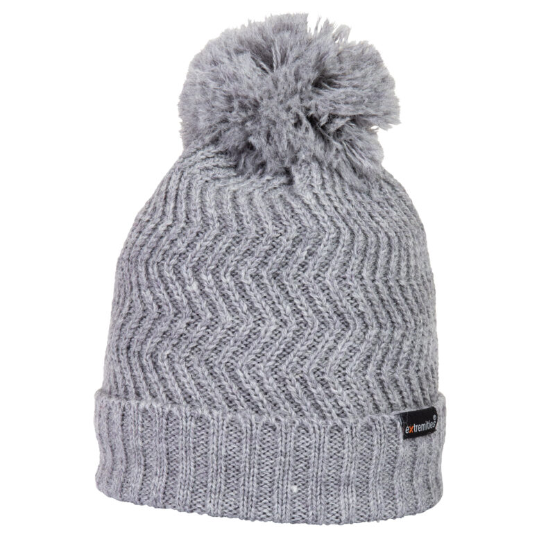 Castleton-Beanie-Smoke-Cut-Out-300dpi-1.jpg Grey knitted beanie with a folded ribbed cuff, zigzag chevron stitch pattern and a fluffy pom-pom on top against a plain white background, with a small black label on the cuff.