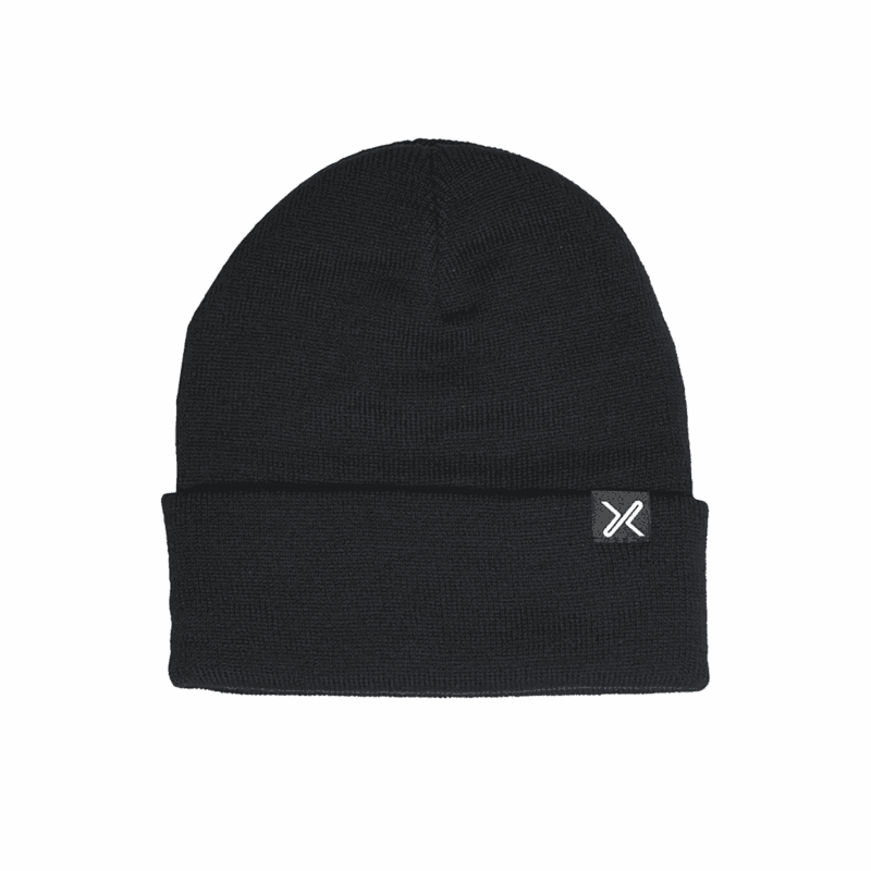 Flak-Eco-Polyana-Beanie-Black1_3000px_300dpi-e1662476777470-1.png Black ribbed knit beanie with a folded cuff and a small square tag showing a white X logo, displayed on a white background.