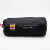Halny-Elite-1-1-3.jpg Black cylindrical storage bag with a red drawcord, Wild Country by Terra Nova logo and white text reading 'HALNY ELITE 1 FOOTPRINT'.