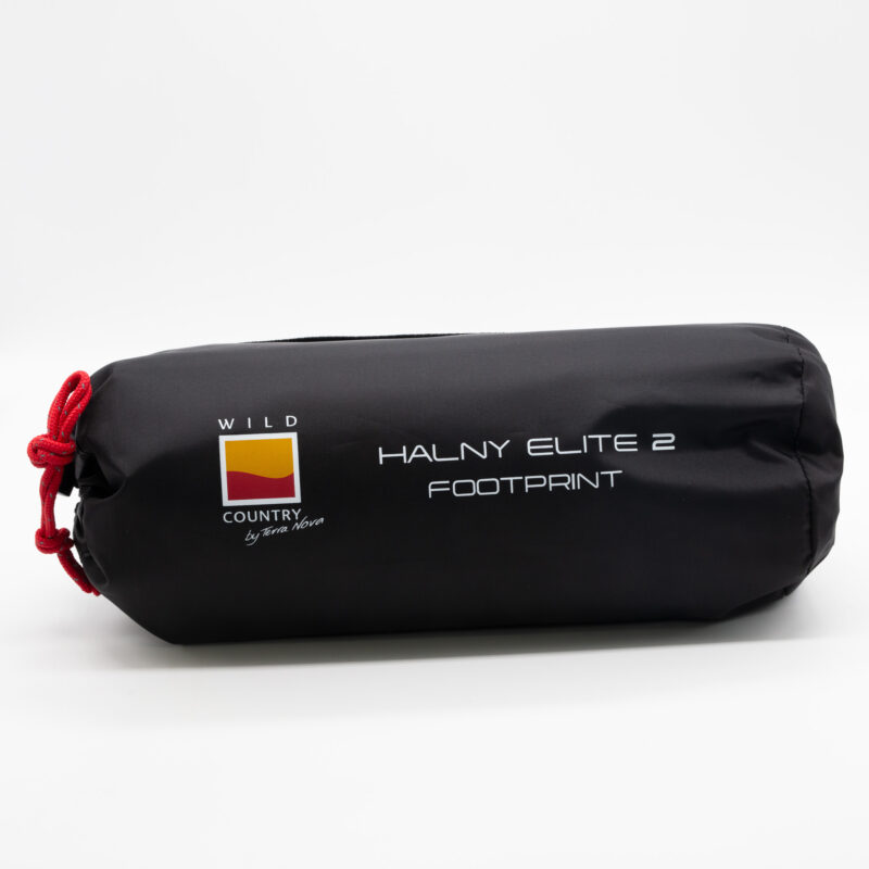 Black cylindrical storage bag with a red drawcord containing a tent footprint, labelled with the Wild Country by Terra Nova logo and the model name 'Halny Elite 2 Footprint', shown on a plain white background.