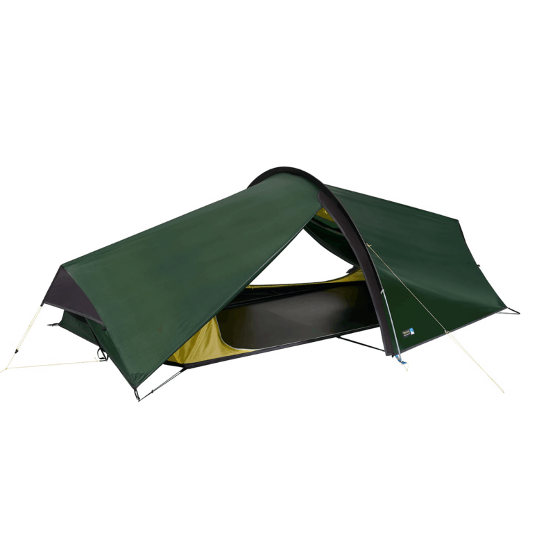 Low-profile one-person green tunnel tent with a dark inner sleeping area trimmed in yellow, supported by a single arched pole and secured with guy lines on a white background.