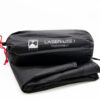 Laser-Lite-1-2-3.jpg Black Terra Nova Laser Lite 1 footprint in a cylindrical stuff sack with red drawcord, labeled with the Terra Nova logo and resting on a folded black groundsheet against a white background.