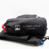 Laser-Lite-2-2-7.jpg Packed black fabric stuff sack labelled Terra Nova Laser Lite 2 Footprint with white logo, a red drawcord and a folded black footprint with a blue tab beneath on a white background.