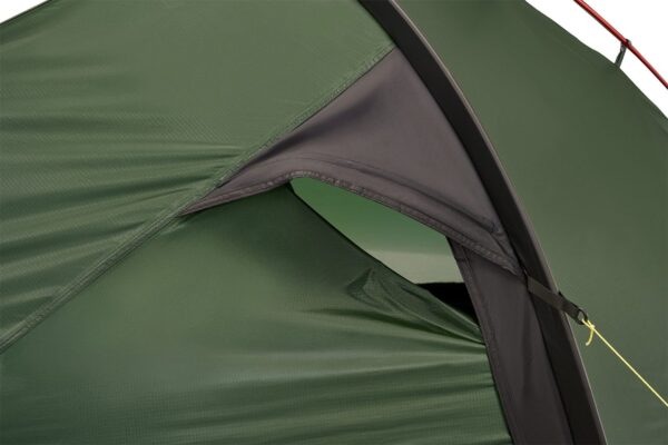 Close-up of a green ripstop tent fly and vented inner door with a black fabric hood supported by a curved pole and secured by a yellow guyline.