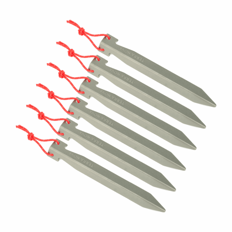 Six grey triangular aluminium tent pegs arranged diagonally on a white background, each with a red knotted cord threaded through a top hole and embossed with TERRA NOVA