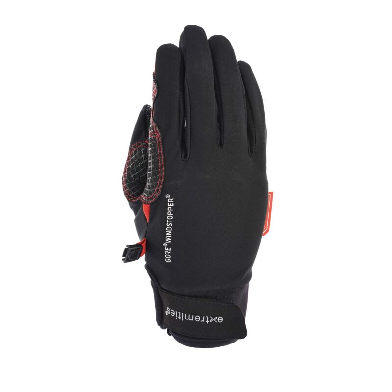 Tor-gloveTerra-Nova-21-09-1612115-1.jpg Black GORE® Windstopper glove with red accents and textured grip patches on the thumb and palm, Velcro wrist strap showing 'extremities' branding, photographed flat on a white background.