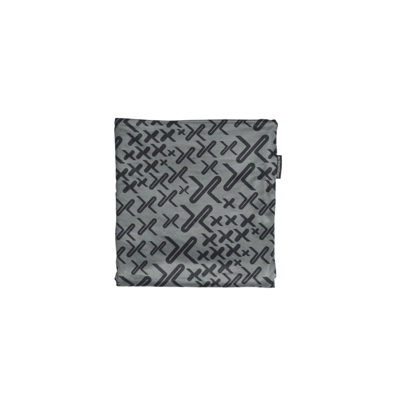 Trek_3000px_300dpi-1.png Folded grey square cloth with a repeating dark X-shaped pattern and a small black tag on the right edge, shown centred on a white background.