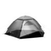 Vault-Duo_1500px-3.jpg Grey dome camping tent labelled Vault Duo with a partially open zippered door showing the inner mesh sleeping area, rainfly and taut guy lines staked out.