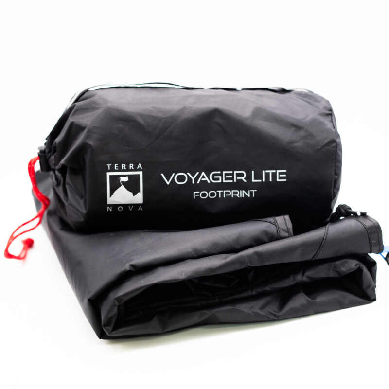 Voyager-Lite-2-3.jpg Folded black Terra Nova Voyager Lite footprint with its cylindrical stuff sack showing the white logo and text 'VOYAGER LITE FOOTPRINT' and a red drawcord at one end.