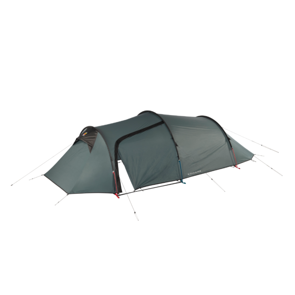 Long dark green tunnel-style camping tent with an extended triangular porch at the front, an arched central entrance flap partly open, black pole seams and multiple guy lines pegged out along the sides