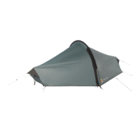 Low-profile grey-green single-person tunnel tent pitched with external guy lines and alloy poles, showing a black-trimmed zipped entrance and tapered foot end.