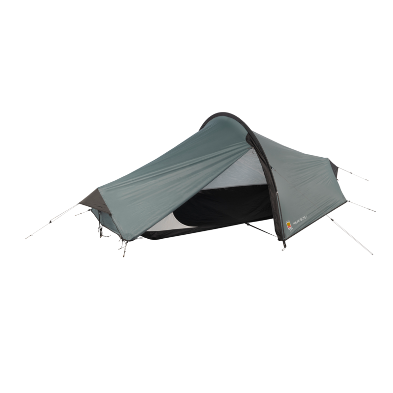WC-Halny-Elite-1-CO6-3.webp Low-profile grey single-person tunnel tent with a partially open rainfly revealing a black inner sleeping compartment, supported by curved poles and tensioned guylines on a white background.