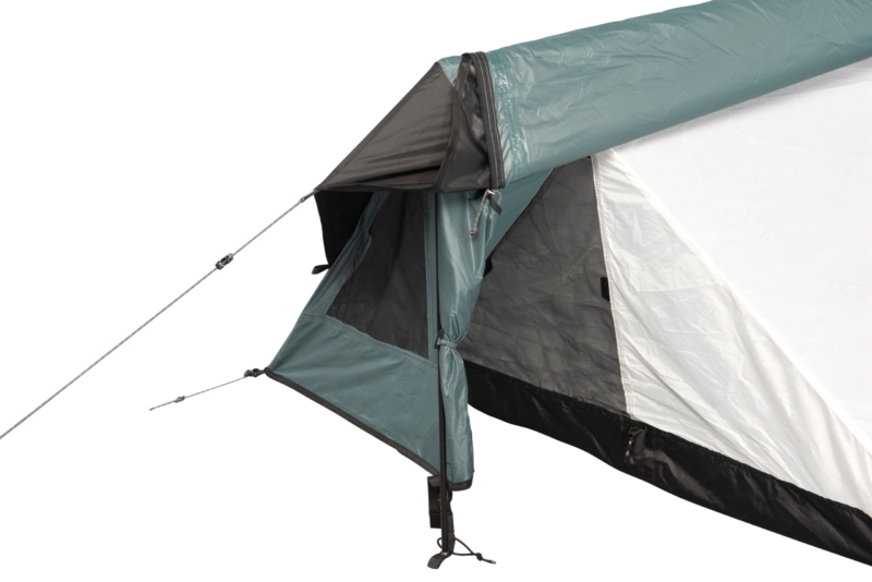 Close-up of a tent entrance showing a teal flysheet and white inner, a partially opened vestibule with zipped flap and mesh panel, taut guy lines and a supporting pole.