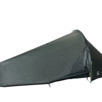 Low-profile dark green single-person bivvy-style tent pitched close to the ground with a tapered aerodynamic shape, zippered entrance at the right, yellow guy lines and a visible 'LASER PULSE' logo near the foot.