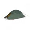 zoom_Expedition_Super_Quasar_Tent_2-e1636623982910-1.jpg Low-profile dark green two-person dome tent with an open front vestibule revealing a yellow inner tent, secured with yellow guy lines and visible red and blue stake tabs on a white background.