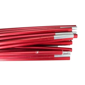 Several red anodised aluminium pole segments with silver ferrules stacked horizontally on a white background