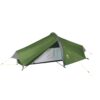 Low-profile green one-person tunnel tent with grey accents and yellow guy lines, partially open at the front to reveal a light-grey inner sleeping area and black pole supports.