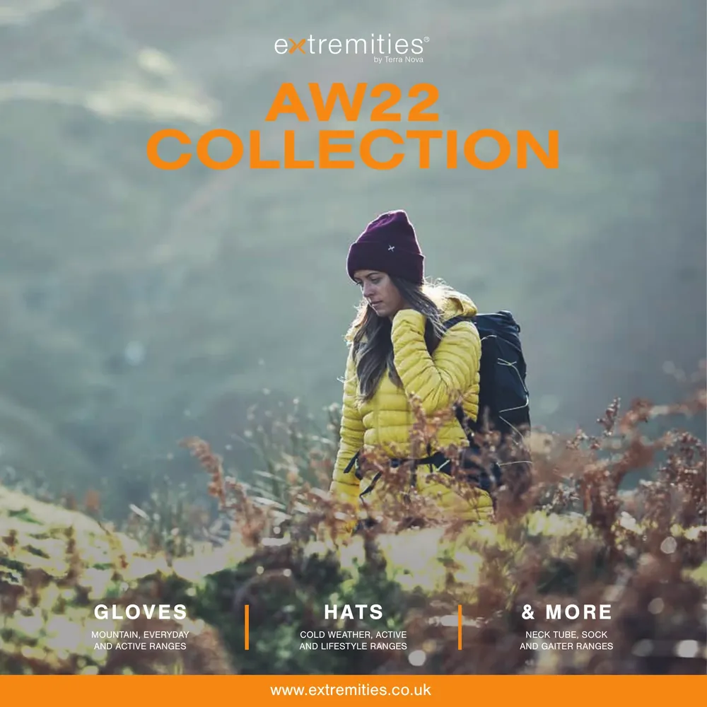 A woman in a yellow jacket and maroon beanie stands in a natural setting, promoting the AW22 collection, featuring gloves, hats, and more outdoor apparel.